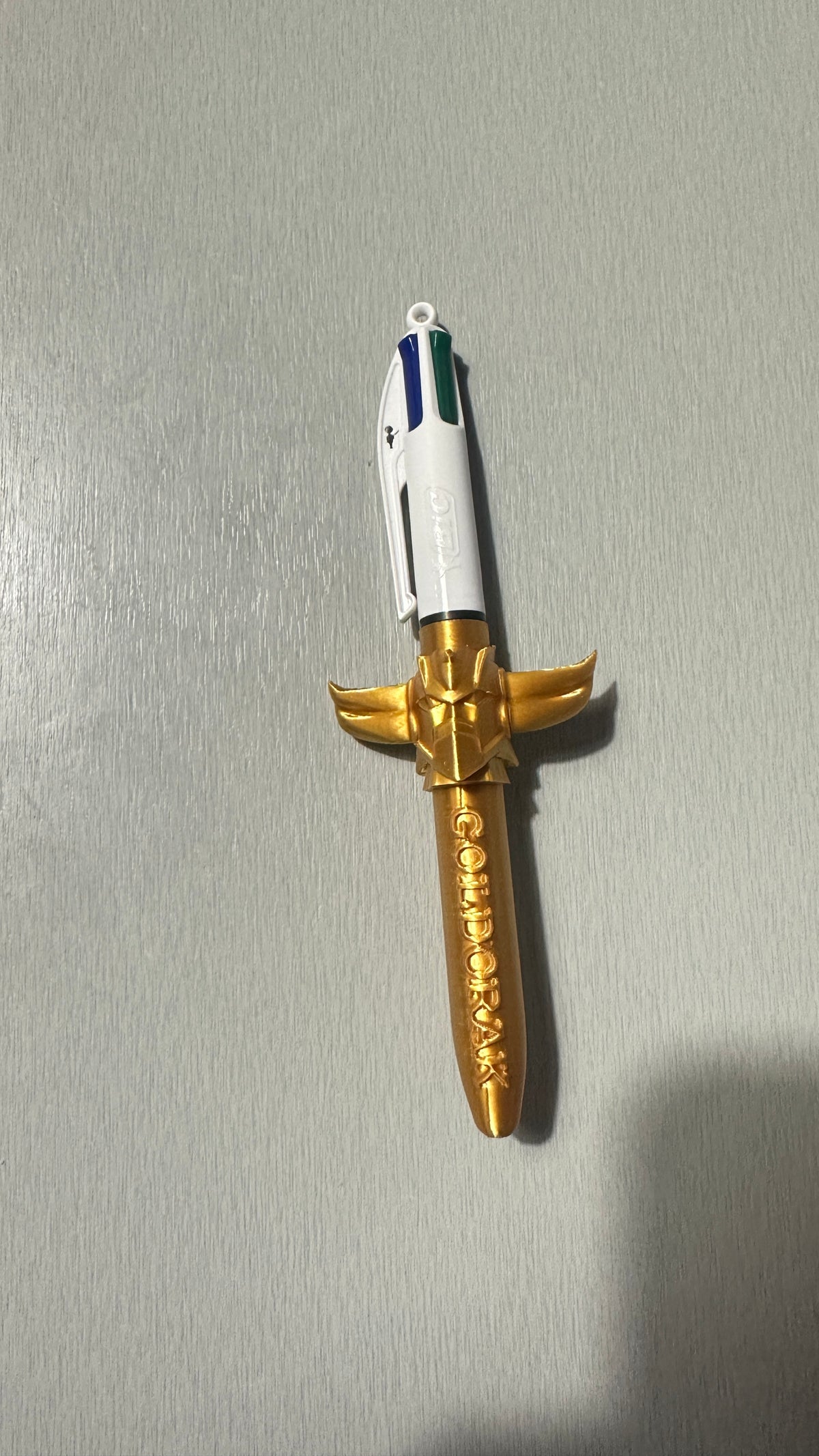 Stylo 4 couleurs avec figurine dorée