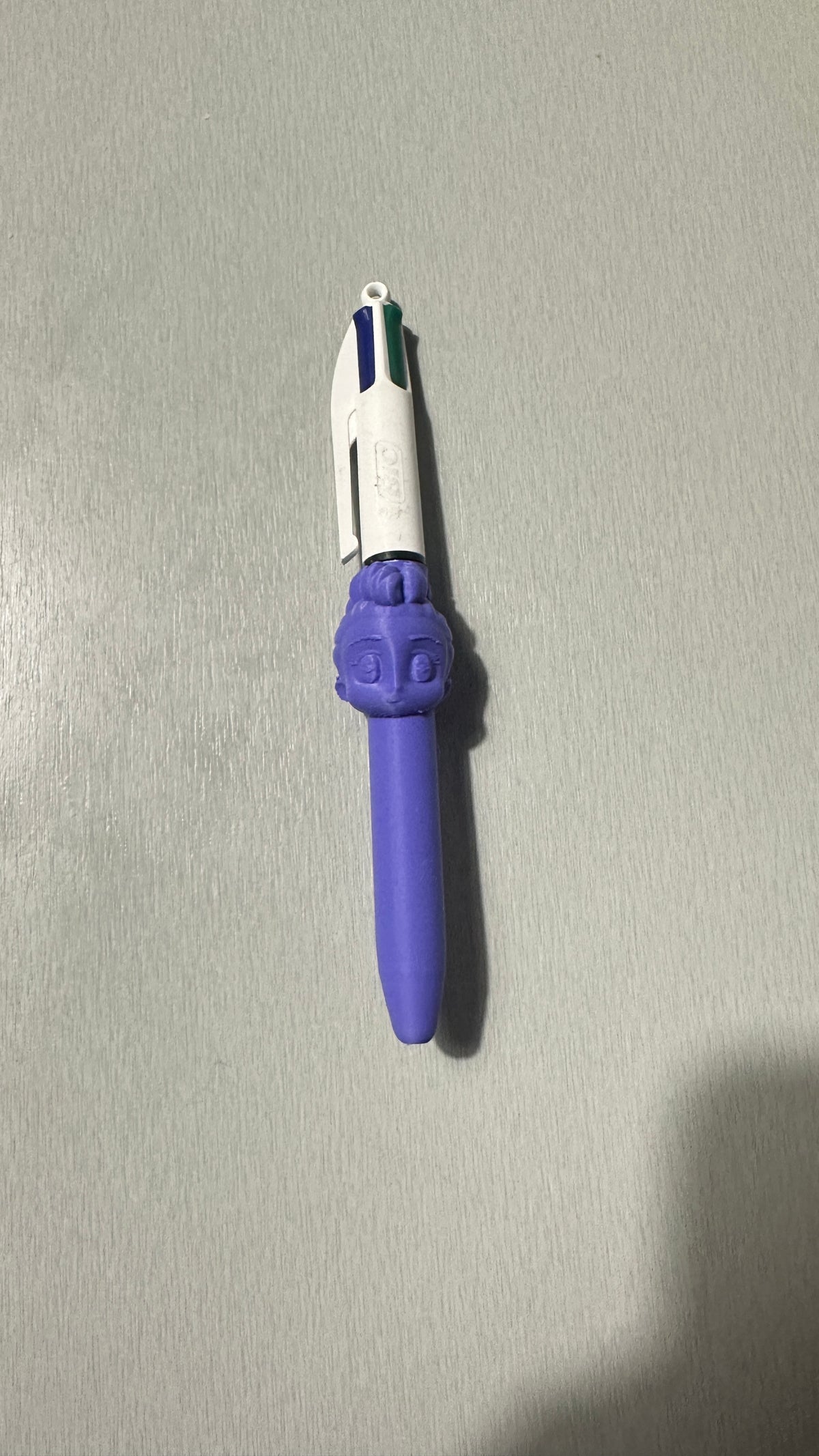 Stylo 4 couleurs avec figurine violette